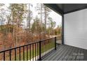 Relaxing outdoor balcony view overlooking trees, providing a serene space to unwind at 436 Nathaniel Way # Brx0042, Charlotte, NC 28213