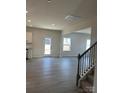 Open concept dining area with hardwood floors and access to backyard at 608 Lispenard Ct, Mount Holly, NC 28120