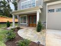 A lovely stone pathway leads to the home's gorgeous wood front doors at 139 Poplar Grove Rd, Mooresville, NC 28117