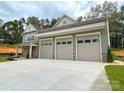 Exterior shot of the home's three-car garage and partial facade at 139 Poplar Grove Rd, Mooresville, NC 28117