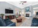 Spacious living room with fireplace and ample seating at 7457 Waterleaf Ct, Stanley, NC 28164