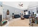 Bright living room featuring comfortable seating and a fireplace at 7457 Waterleaf Ct, Stanley, NC 28164