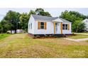 Newly remodeled home, featuring a white exterior, and landscaping at 216 St Michael Ave, Great Falls, SC 29055