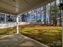 Fenced backyard with a patio and mature trees at 328 Shinnville Rd, Mooresville, NC 28115