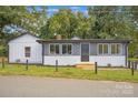 Updated ranch home with gray and white exterior, showcasing curb appeal at 123 Market Rd, Mooresville, NC 28115