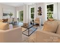 Spacious living room with a neutral color palette and ample natural light at 734 Cantwell St, Charlotte, NC 28208