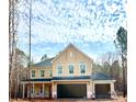 A new two-story home featuring a spacious three-car garage, enhancing functionality and curb appeal at 1021 Baylor Grv, Monroe, NC 28110