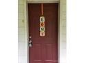 A welcoming front door adorned with a decorative 'HOME' sign, adding a personal touch to the entrance at 113 Fairview St, Clover, SC 29710