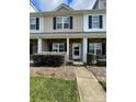 Charming townhome with well-kept front yard, stone accents, and inviting entrance at 4327 Kobuk Ln, Charlotte, NC 28269