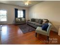Bright living room with hardwood floors, comfortable seating, and a welcoming atmosphere at 4327 Kobuk Ln, Charlotte, NC 28269