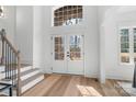 Light-filled entryway with double doors and hardwood flooring at 3001 Sparrow Springs Rd, Gastonia, NC 28052
