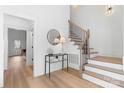 Bright and airy foyer with hardwood floors and elegant staircase at 3001 Sparrow Springs Rd, Gastonia, NC 28052