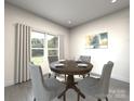 Inviting dining room with a round table, seating for four, and a large window at 203 Alden Ct, Shelby, NC 28152