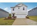 Inviting two-story home with a well-maintained lawn and attached two car garage at 203 Alden Ct, Shelby, NC 28152