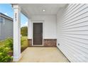 Covered porch with brick accents, offering a welcoming entrance to the home at 203 Alden Ct, Shelby, NC 28152