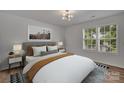 Spacious bedroom with neutral walls and large windows at 5346 Johnston Mill Ct, Charlotte, NC 28269