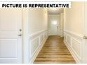 Bright entryway with wood-look floors and white wainscoting at 131 Sari St, Troutman, NC 28166