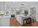 Bright, modern kitchen with white cabinets, stainless steel appliances, and an island with bar seating at 2733 Wellington St, Rock Hill, SC 29732