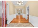 Inviting foyer with hardwood floors, traditional moldings, and a chandelier at 405 7Th St, Spencer, NC 28159