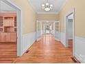 Spacious living room featuring gleaming hardwood floors and French doors leading to the outdoors at 405 7Th St, Spencer, NC 28159