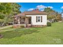 Cute Ranch style home with American flag and well-manicured lawn at 410 Gaddy St, Kannapolis, NC 28081