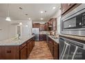 Modern kitchen with stainless steel appliances, granite countertops and a large center island with barstool seating at 984 Kirby Dr, Fort Mill, SC 29715