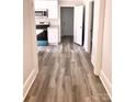 Bright hallway with wood-look flooring leading to rooms at 1012 4Th St, Statesville, NC 28677