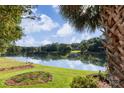 Scenic view of a calm lake reflecting the sky and surrounding trees at 1873 Farrow Dr, Rock Hill, SC 29732