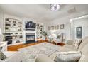 Cozy living room featuring a fireplace, built-in bookshelves, and plush seating arrangement at 6421 Chadwell Ct # 61, Fort Mill, SC 29707