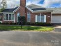 Beautiful brick home featuring a garage and well-manicured landscaping at 11311 Olde Turnbury Ct, Charlotte, NC 28277