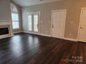 Bright and spacious living room with hardwood floors and a cozy fireplace at 11311 Olde Turnbury Ct, Charlotte, NC 28277