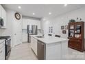 Modern kitchen featuring white cabinets, stainless steel appliances, and an island at 939 Cobbled Way, Fort Mill, SC 29715