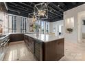 Modern kitchen featuring a large island and high-end appliances at 127 Tryon N St # 503, Charlotte, NC 28202