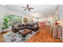 Open floor plan with living room and kitchen, hardwood floors at 7954 Rolling Creek Ct, Charlotte, NC 28270