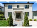 Elegant home exterior with brick facade and black windows at 1446 Queens W Rd, Charlotte, NC 28207