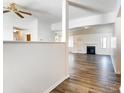 Bright living room featuring hardwood floors, fireplace, and an open concept design at 416 Linsbury Ct, Gastonia, NC 28056