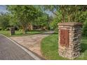 Stone pillar with house number at entrance to a paver driveway leading to the home at 156 Marietta Rd, Mooresville, NC 28117