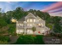 Spacious waterfront home with multi-level decks and patios for enjoying stunning lake views and outdoor living at 4145 Cindy Ln, Denver, NC 28037