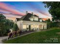Elegant home with manicured lawn, covered porch, and inviting facade, perfect for curb appeal and Southern charm at 4145 Cindy Ln, Denver, NC 28037