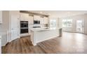 Spacious kitchen with white cabinets, island, and hardwood floors at 4469 Doyle Ridge Rd, Maiden, NC 28650