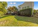 Landscaped backyard with wooden fence at 9826 Edinburgh Ln # 282, Charlotte, NC 28269