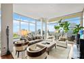 Airy living room filled with natural light, comfortable seating, and cityscape views at 215 N Pine St # 3705, Charlotte, NC 28202