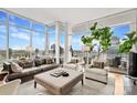 Spacious living room boasting stylish decor, expansive windows, and an inviting atmosphere at 215 N Pine St # 3705, Charlotte, NC 28202
