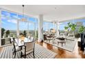 Bright, open living space with floor-to-ceiling windows and hardwood floors at 215 N Pine St # 3705, Charlotte, NC 28202