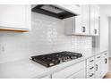 Modern kitchen with white subway tile backsplash and a gas stovetop at 5735 Allburn Pkwy, Concord, NC 28027