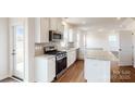 Modern kitchen with granite counters, stainless steel appliances, and island at 2074 Van Buren Rd, Sherrills Ford, NC 28673