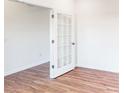Open office area with hardwood floors and French doors at 2074 Van Buren Rd, Sherrills Ford, NC 28673