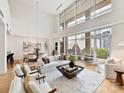 Bright, open living room with floor-to-ceiling windows and modern decor at 435 S Tryon St # 301, Charlotte, NC 28202