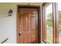 The front door featuring address number 26 and a window, providing natural light into the home at 525 12Th Sw St # 26, Hickory, NC 28602