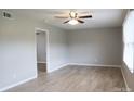 The bright living room boasts laminated wood floors, neutral colored walls, and a ceiling fan at 525 12Th Sw St # 26, Hickory, NC 28602